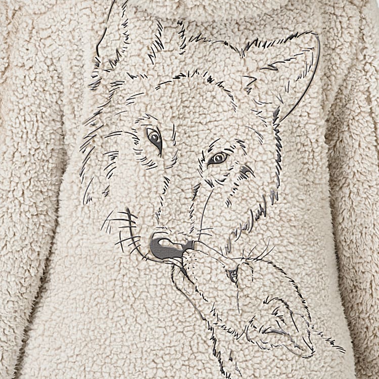 Warmth Of The Wild Womens Lightweight Sherpa Jacket Fully Lined In A Coordinating Blue Jersey Knit Featuring Embroidered Wolf Art On The Back With A Silver Toned Paw Print Charm Zipper Pull