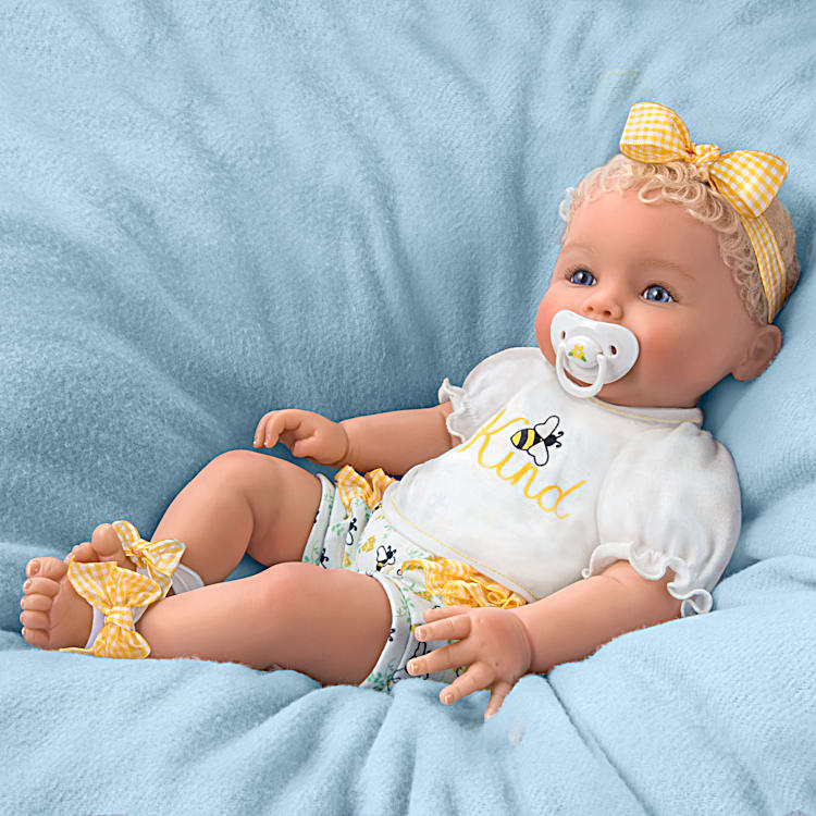 Baby doll that takes real pacifier top